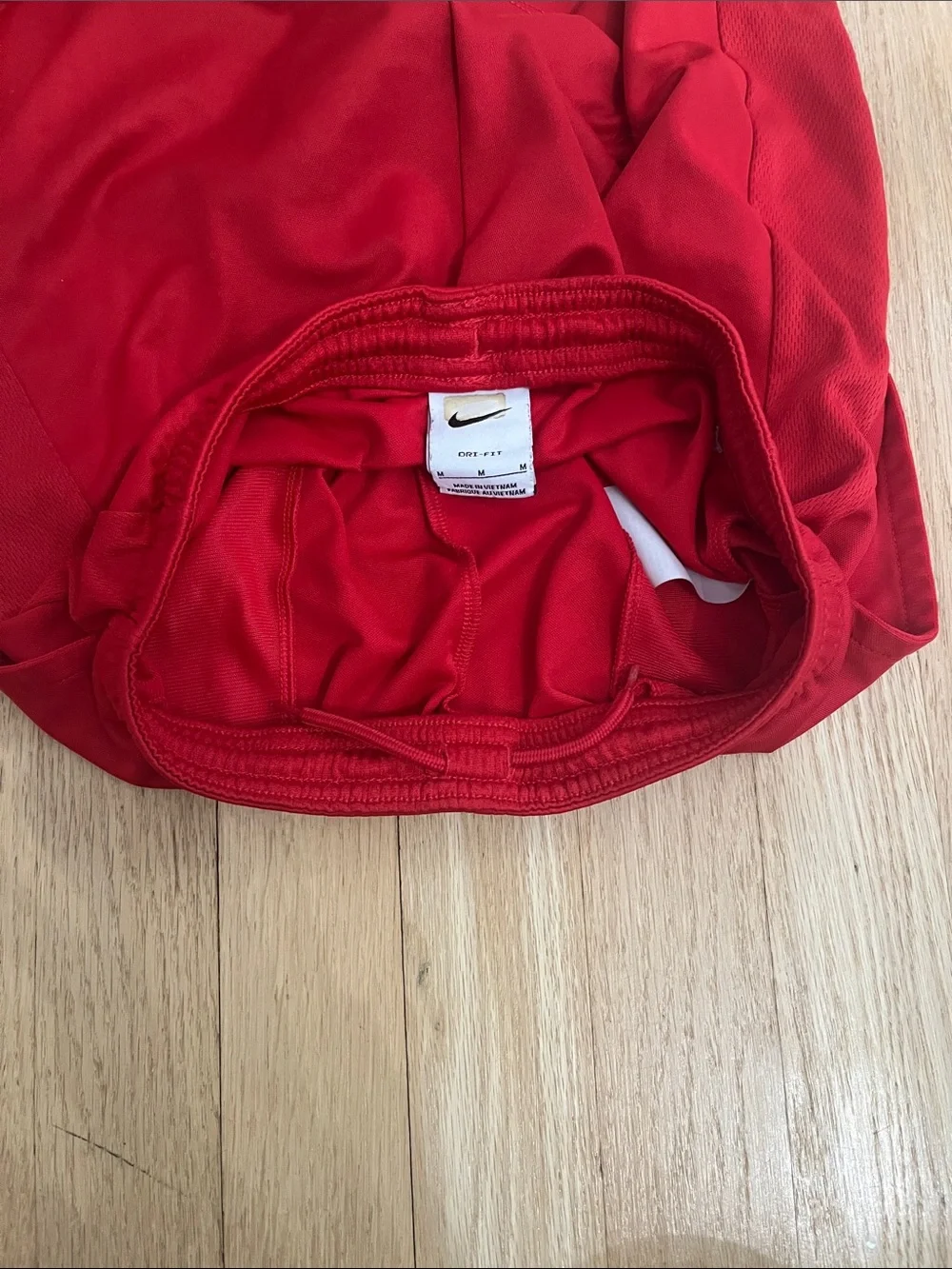 Nike Red Athletic Shorts with White Swoosh